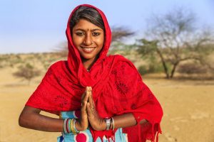 Namaste gesture from a smiling face